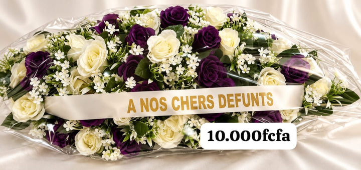 Gerbe horizontale de roses violettes et blanches, ruban « À nos chers défunts »